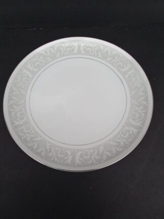 White plate with grey floral border.