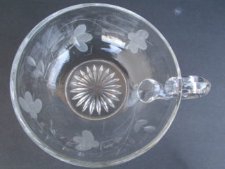 Cup with flower and star designs