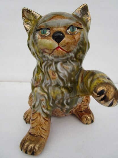 Ceramic cat figurine with gold accents.