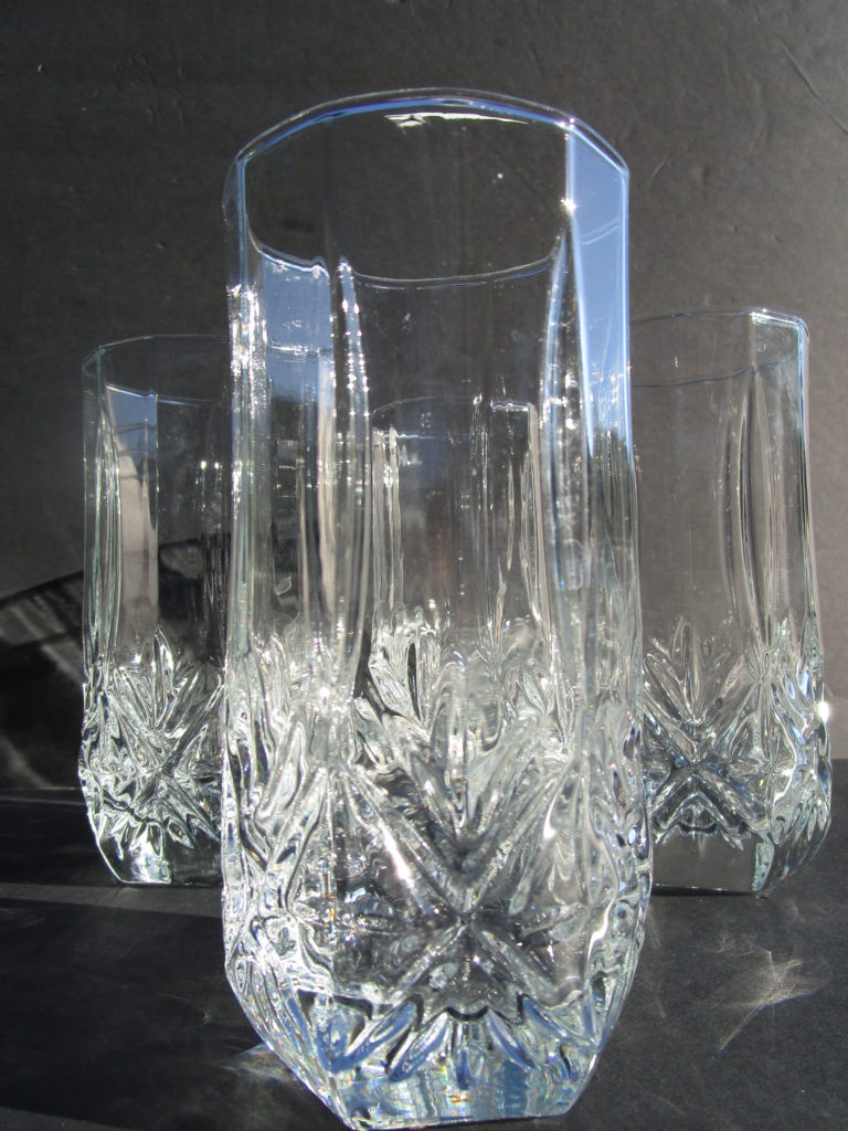 a set of three clear beverage glasses