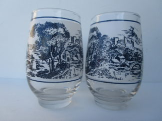 Two designer glasses with embossed scenery
