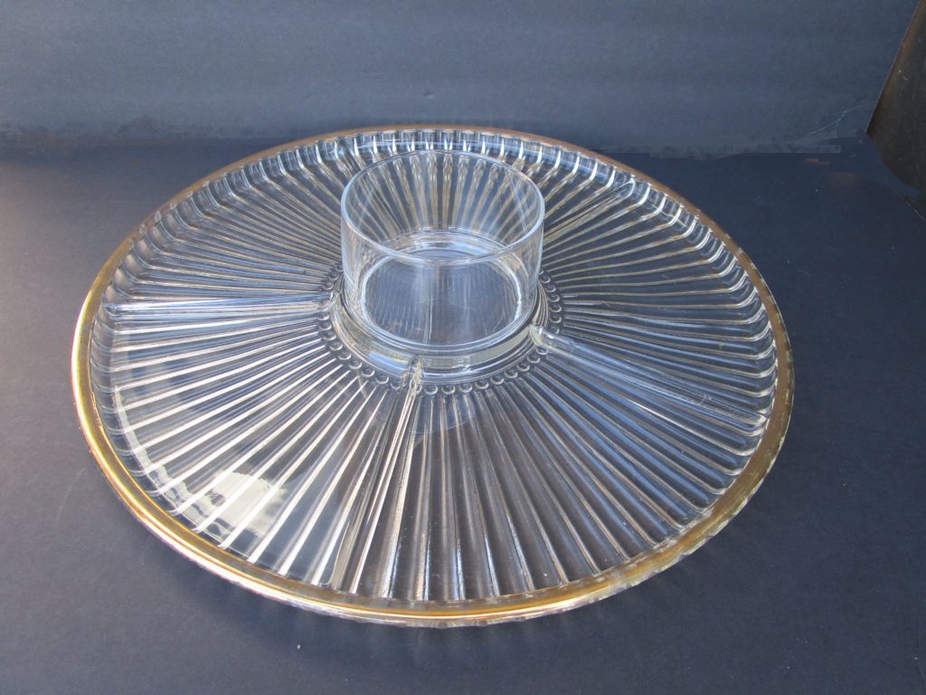 a plate with a soup bowl in the middle