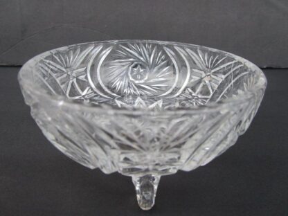 Cut glass footed bowl with intricate design.