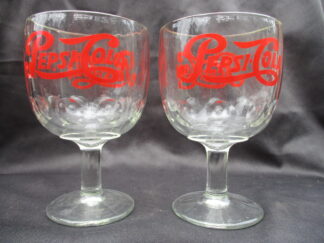 Pepsi Cola is written in these clear glass goblets