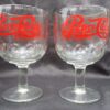 Pepsi Cola is written in these clear glass goblets