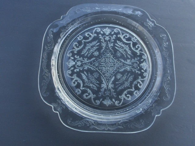 a clear plate with an intricate design
