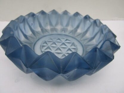 Blue glass bowl with a geometric pattern.