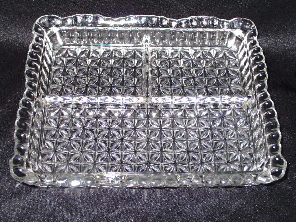 Part tray flaring rim with underside flower carvings