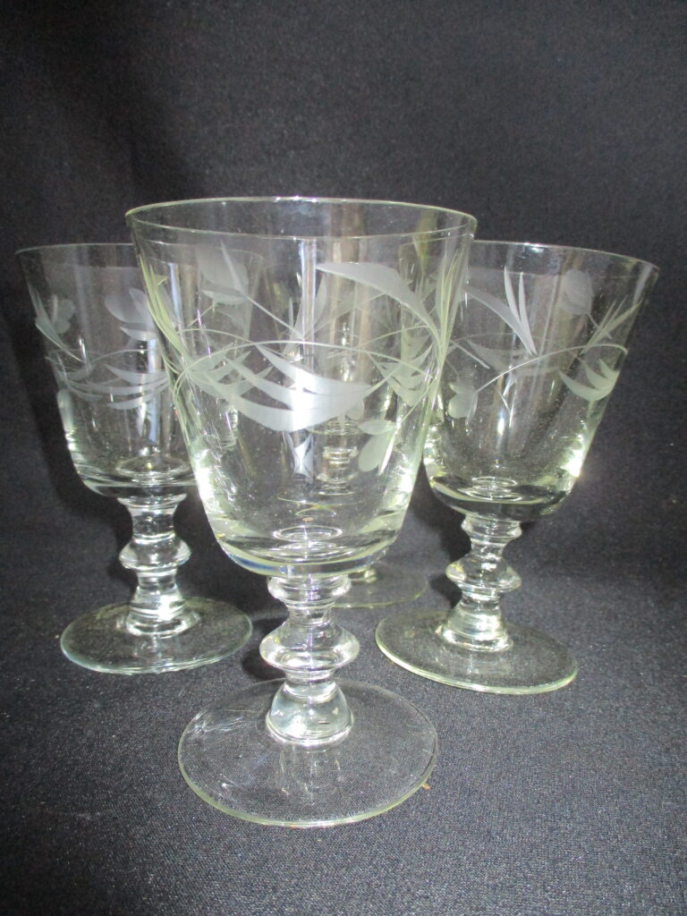 Clear glass wine glass set with tulips and foliage etchings