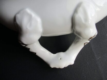A close up of the back end of a white object.