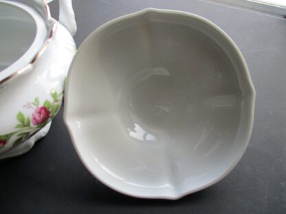 A white bowl sitting on top of a table.