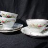 A couple of cups and saucers on top of a table.