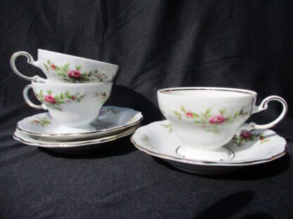 A couple of cups and saucers on top of a table.