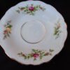 A white plate with pink flowers on it