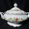 A white bowl with flowers on it