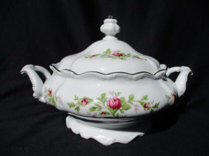 A white bowl with flowers on it