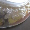 A close up of the leaves on the glass bowl