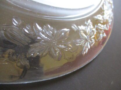 A close up of the leaves on the glass bowl